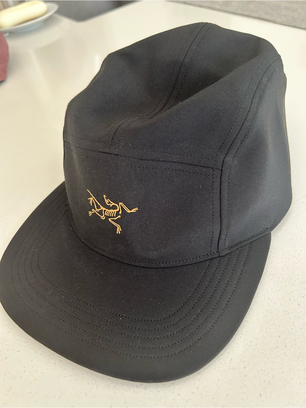 Arc'teryx Black Five-Panel Cap with Yellow Logo